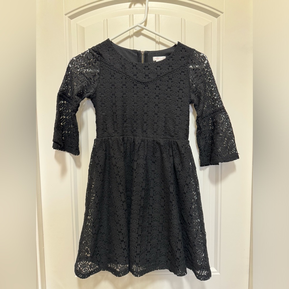 Girls black bell sleeved dress. Size medium